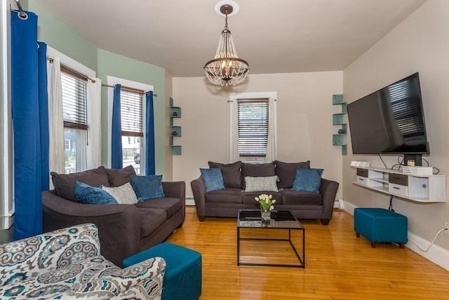 56-A Topliff St, Boston, MA 02122 - living area with a chandelier, hardwood / wood-style flooring, and a baseboard radiator