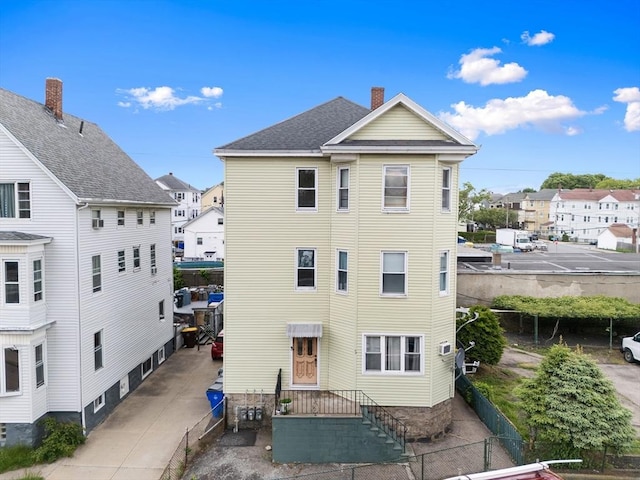 90 Montaup St, Fall River, MA 02724 - back of property featuring a residential view and a chimney