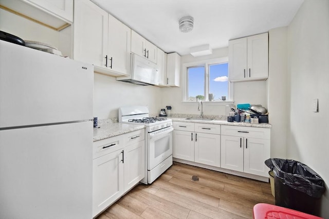 90 Montaup St, Fall River, MA 02724 - kitchen featuring white appliances, a sink, white cabinets, light wood finished floors, and light stone countertops