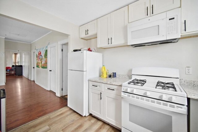 90 Montaup St, Fall River, MA 02724 - kitchen with white appliances, light wood-style flooring, white cabinets, light stone countertops, and crown molding