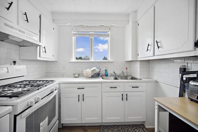 90 Montaup St, Fall River, MA 02724 - kitchen featuring gas range gas stove, under cabinet range hood, a sink, light countertops, and white cabinets