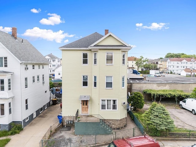 90 Montaup St, Fall River, MA 02724 - back of property featuring a residential view and a chimney