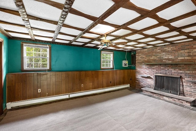 5 Glad St, Freetown, MA 02702 - unfurnished living room with baseboard heating, wainscoting, wooden walls, healthy amount of natural light, and a brick fireplace