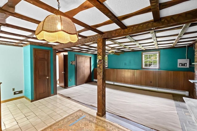 5 Glad St, Freetown, MA 02702 - basement featuring a baseboard radiator, wainscoting, wood walls, tile patterned floors, and electric panel