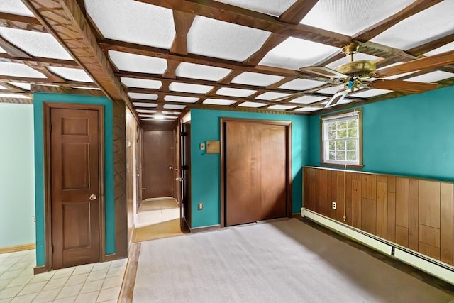 5 Glad St, Freetown, MA 02702 - unfurnished bedroom featuring baseboard heating, coffered ceiling, a closet, baseboards, and light tile patterned flooring
