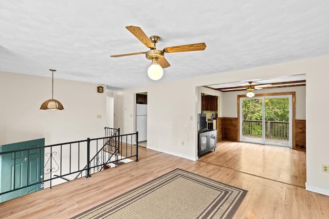 5 Glad St, Freetown, MA 02702 - unfurnished living room with ceiling fan, wood finished floors, and baseboards