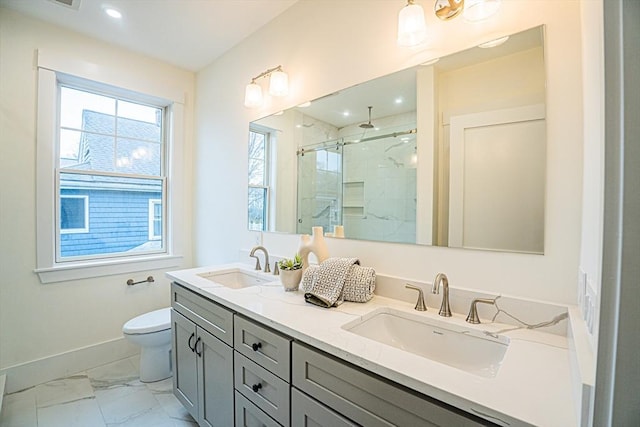 full bathroom featuring baseboards, a sink, marble finish floor, and a marble finish shower