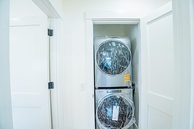 laundry area with laundry area and stacked washing maching and dryer