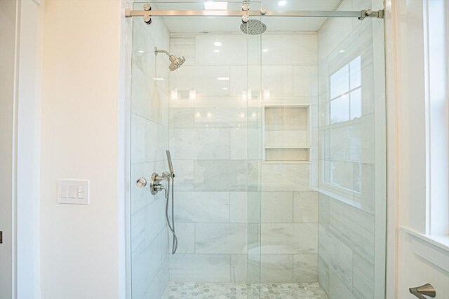 bathroom featuring a shower stall