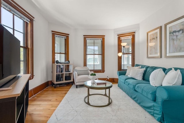 living room with light wood-style floors and baseboards