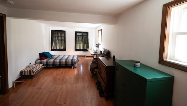bedroom with wood finished floors
