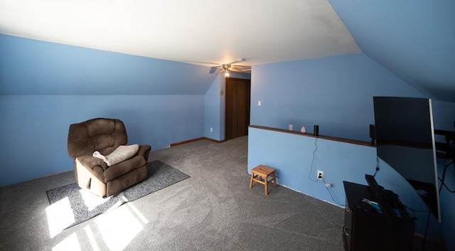 unfurnished room featuring ceiling fan, carpet, and lofted ceiling