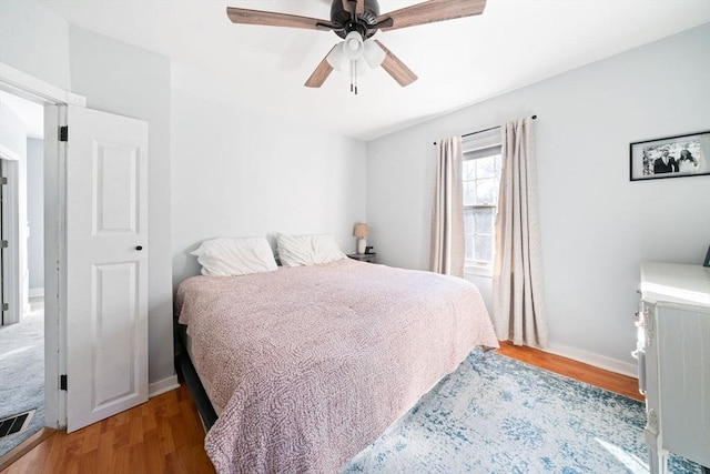 bedroom featuring light wood-type flooring and ceiling fan