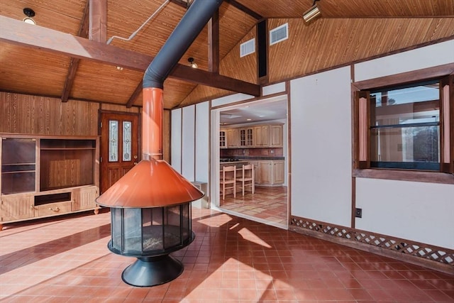 interior space with tile patterned flooring, visible vents, and wooden ceiling