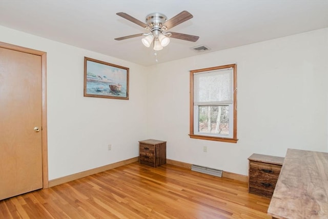 unfurnished bedroom with light wood-style flooring, baseboards, and visible vents