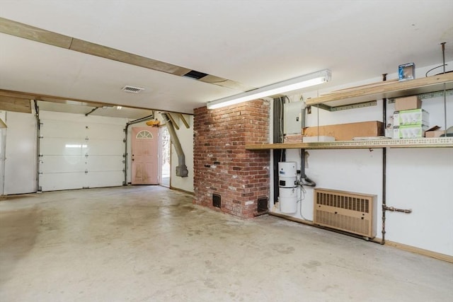 garage with baseboards and visible vents