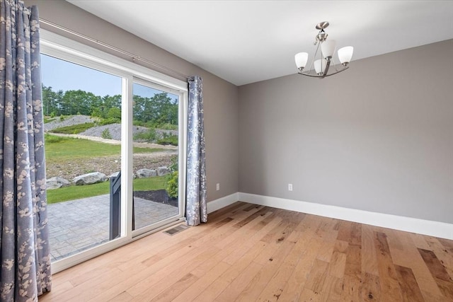 194B Narrows Rd, Westminster, MA 01473 - unfurnished room featuring a chandelier, light wood-style flooring, and baseboards