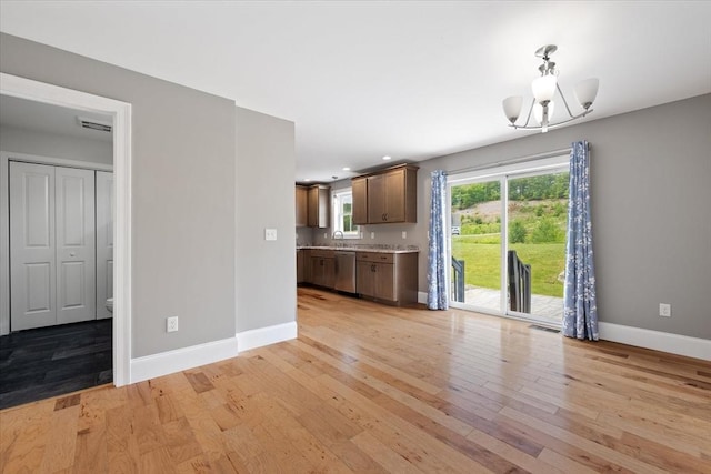 194B Narrows Rd, Westminster, MA 01473 - kitchen with stainless steel dishwasher, baseboards, light wood-style floors, light countertops, and recessed lighting