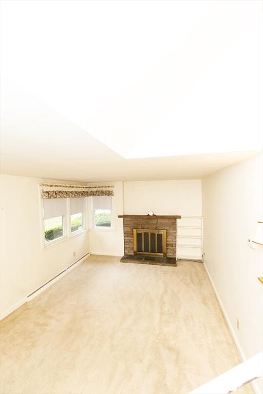 460 Front St, Weymouth, MA 02188 - unfurnished living room with light carpet, a fireplace, a baseboard heating unit, and baseboards