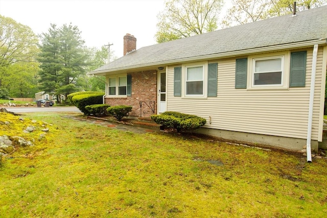460 Front St, Weymouth, MA 02188 - view of front of property featuring a chimney, a front yard, and brick siding