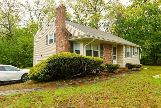 460 Front St, Weymouth, MA 02188 - view of front of property featuring a chimney, a garage, and a front yard