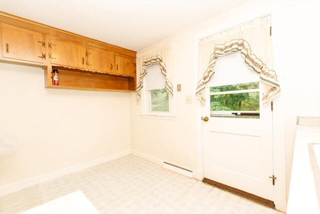 460 Front St, Weymouth, MA 02188 - doorway to outside with light flooring, baseboards, and a baseboard radiator