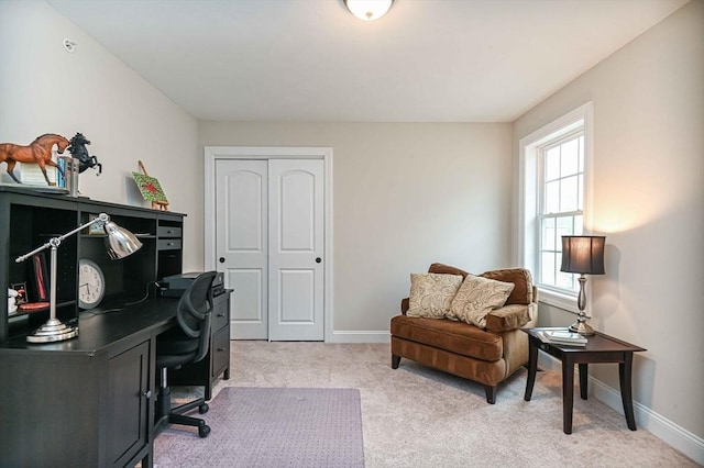 home office featuring light colored carpet and baseboards