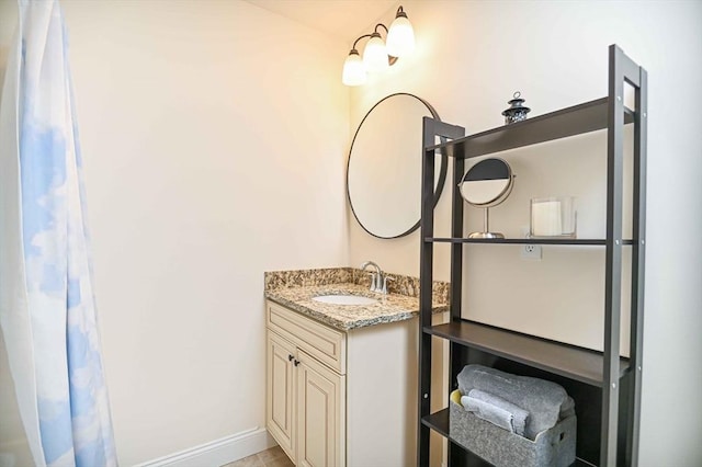 bathroom featuring vanity and baseboards
