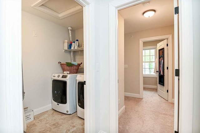 laundry area featuring washer and clothes dryer, attic access, and baseboards