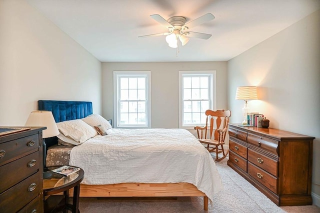 bedroom with light colored carpet and ceiling fan