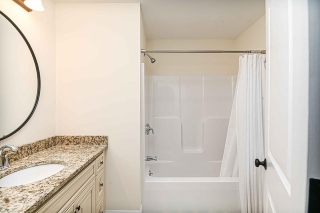 full bath with shower / tub combo with curtain and vanity