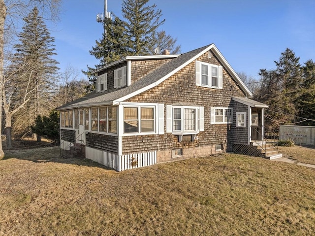 exterior space with a sunroom and a front yard