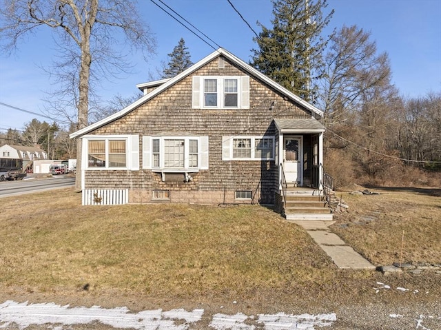 view of front of home featuring a front yard