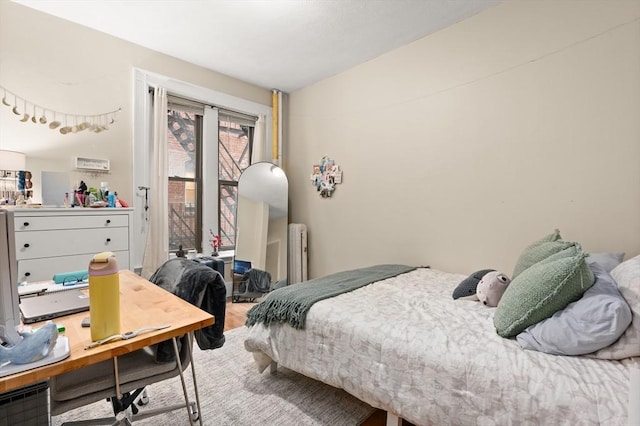 293-295 Commonwealth Ave Unit 3B, Boston, MA 02115 - bedroom with radiator, wood finished floors, and vaulted ceiling