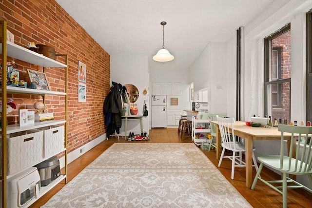 293-295 Commonwealth Ave Unit 3B, Boston, MA 02115 - dining space featuring brick wall and wood finished floors