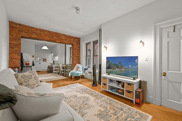293-295 Commonwealth Ave Unit 3B, Boston, MA 02115 - living room with wood finished floors and brick wall