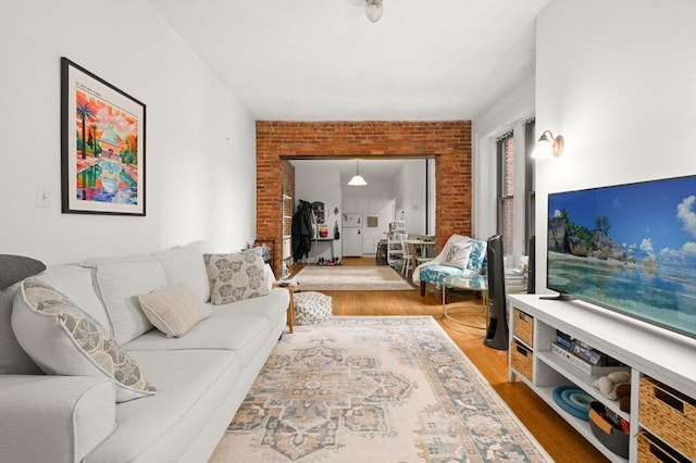 293-295 Commonwealth Ave Unit 3B, Boston, MA 02115 - living room with wood finished floors and brick wall
