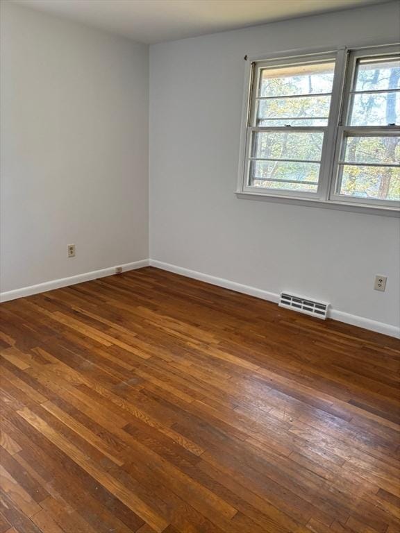 83 Partridge Valley Rd, Yarmouth, MA 02673 - spare room featuring dark wood-style floors, baseboards, and healthy amount of natural light