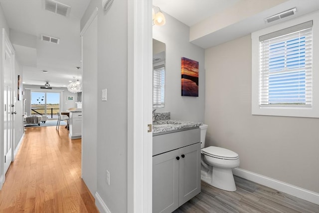35 Liberty St, Salisbury, MA 01952 - bathroom with wood finished floors, vanity, toilet, and baseboards
