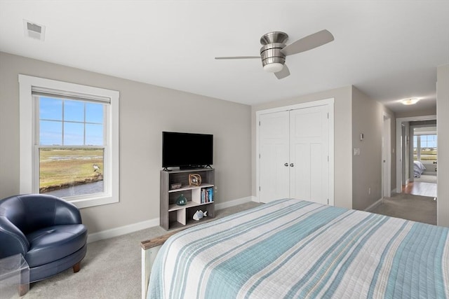 35 Liberty St, Salisbury, MA 01952 - bedroom featuring carpet, baseboards, ceiling fan, and a closet