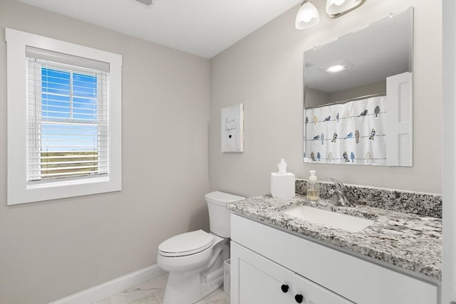 35 Liberty St, Salisbury, MA 01952 - bathroom with marble finish floors, baseboards, vanity, and toilet