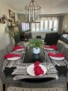 dining space featuring an inviting chandelier