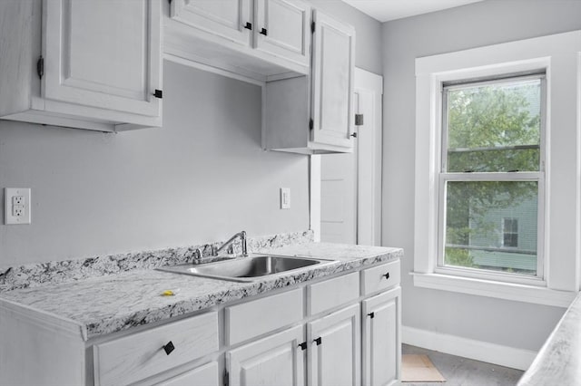 14-18 Florence St, Leominster, MA 01453 - kitchen with a sink, light countertops, healthy amount of natural light, and baseboards