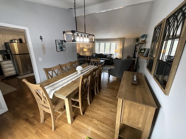 dining space featuring wood-type flooring