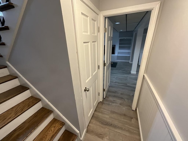 stairs featuring hardwood / wood-style flooring