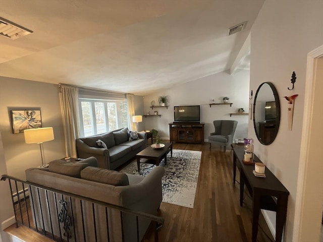 living room with dark wood-type flooring, baseboard heating, and vaulted ceiling with beams