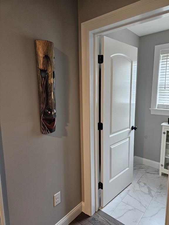 3 Panda Ct Unit 3, Milford, MA 01757 - hall with marble finish floors and baseboards