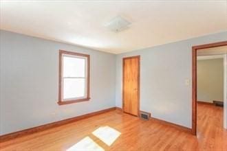 unfurnished room with light hardwood / wood-style floors