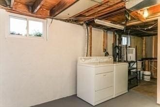 basement featuring washer and clothes dryer