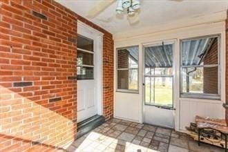 exterior space featuring ceiling fan